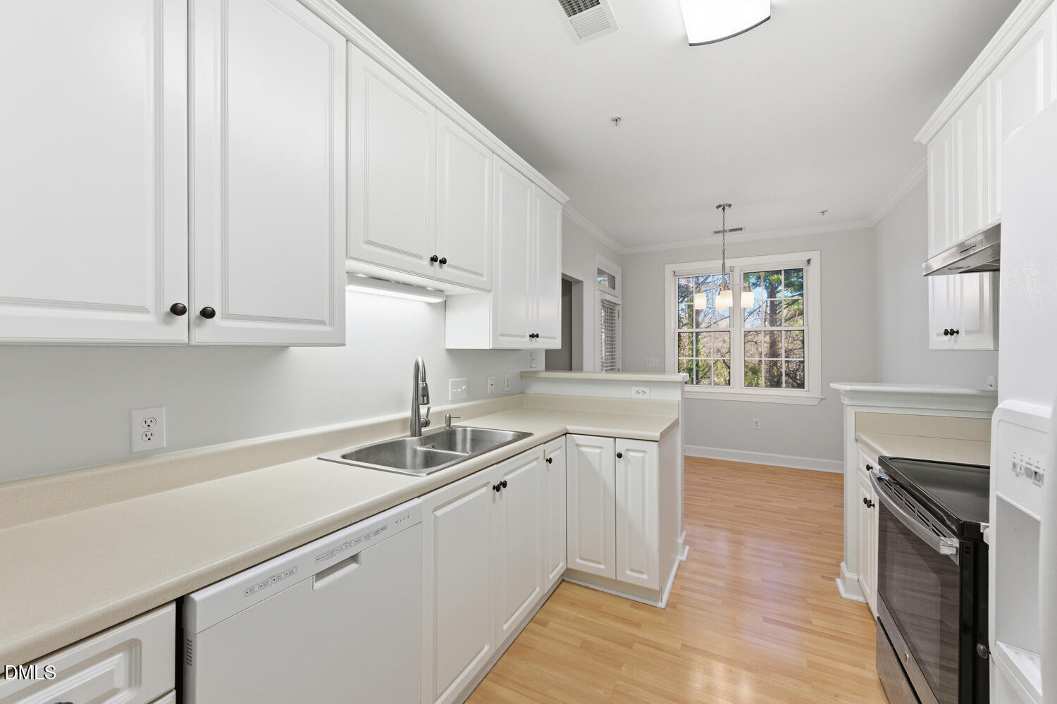 116 Northbrook Drive, Unit 204 Raleigh, NC 27609 - Photo 23 of 94 a kitchen with a sink stove and cabinets