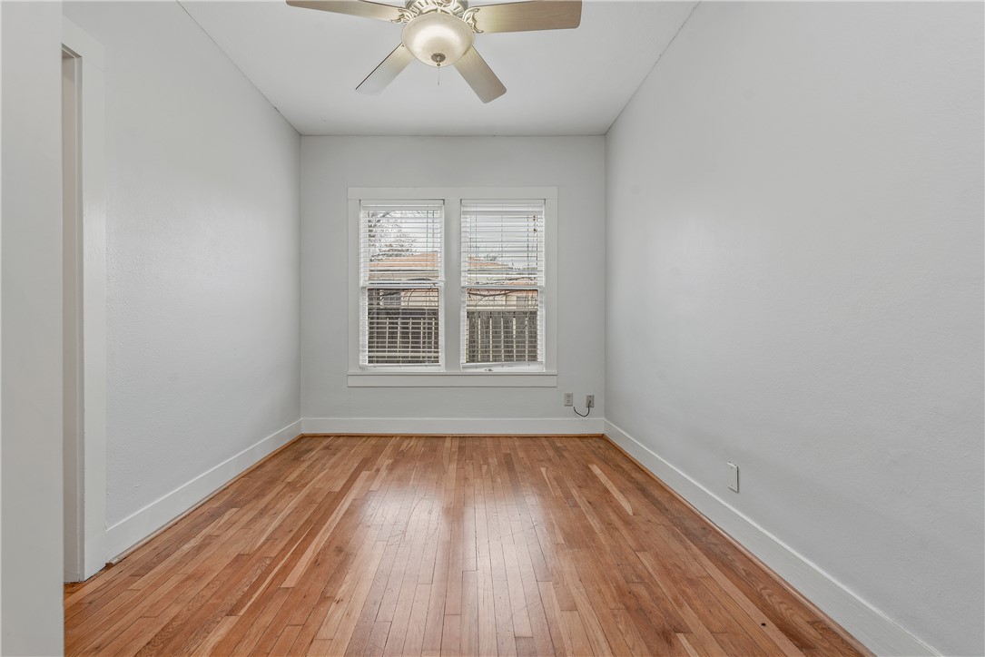 304 North Haswell Drive Bryan, TX 77803 - Photo 12 of 17 a view of empty room with wooden floor and fan
