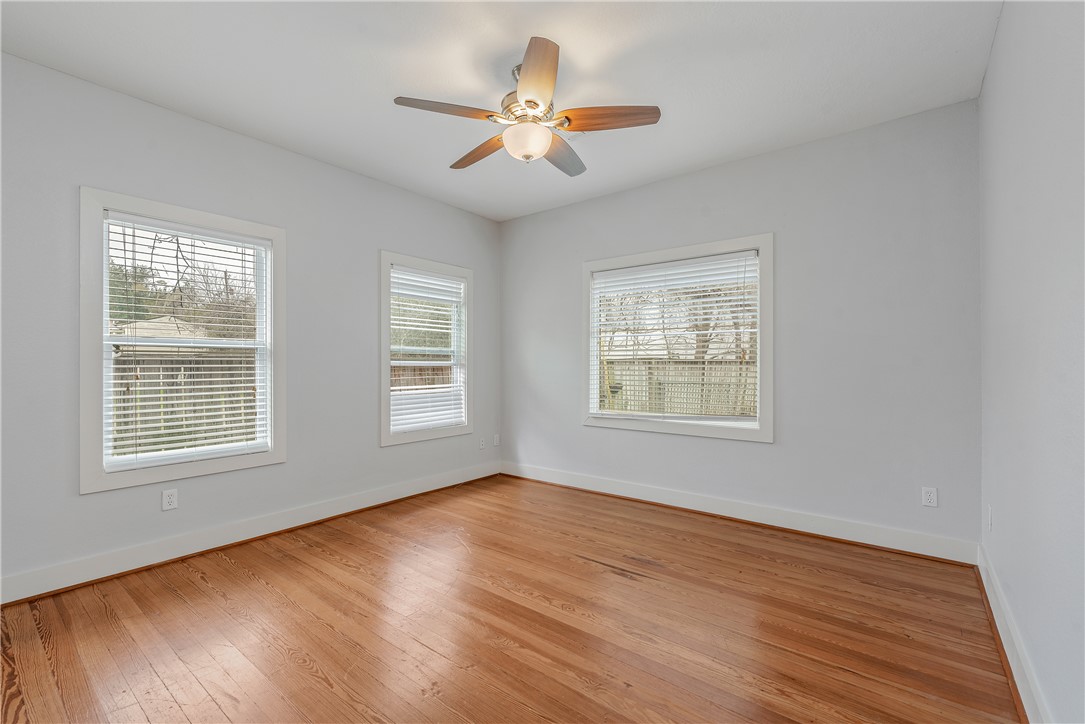 304 North Haswell Drive Bryan, TX 77803 - Photo 13 of 17 a view of an empty room with wooden floor and a window