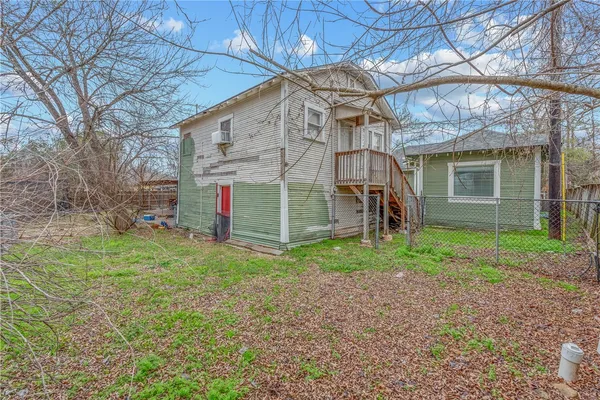 a view of a house with a yard and a garage