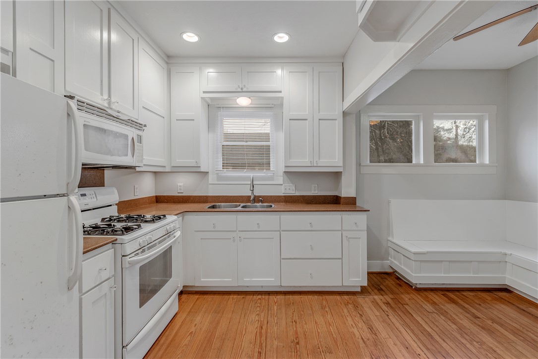 304 North Haswell Drive Bryan, TX 77803 - Photo 8 of 17 a kitchen with stainless steel appliances granite countertop a stove a sink and a refrigerator