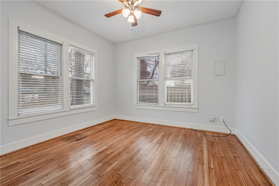 304 North Haswell Drive Bryan, TX 77803 - Photo 10 of 17 a view of an empty room with wooden floor and a window
