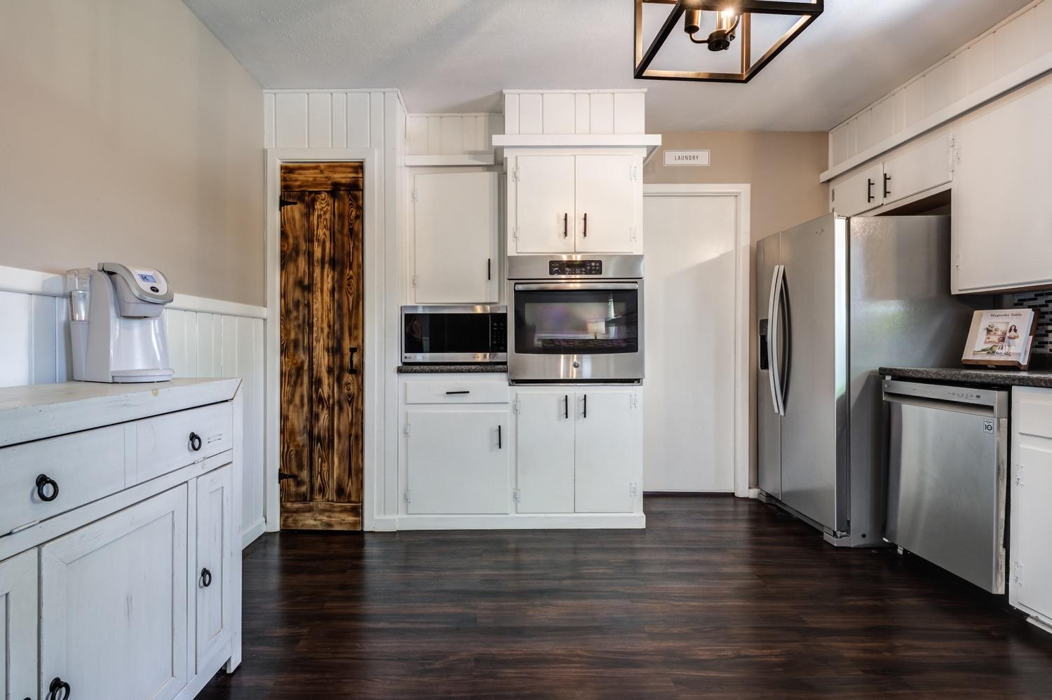 2306 61st Street Lubbock, TX 79412 - Photo 17 of 35 a kitchen with stainless steel appliances a refrigerator and a stove top oven