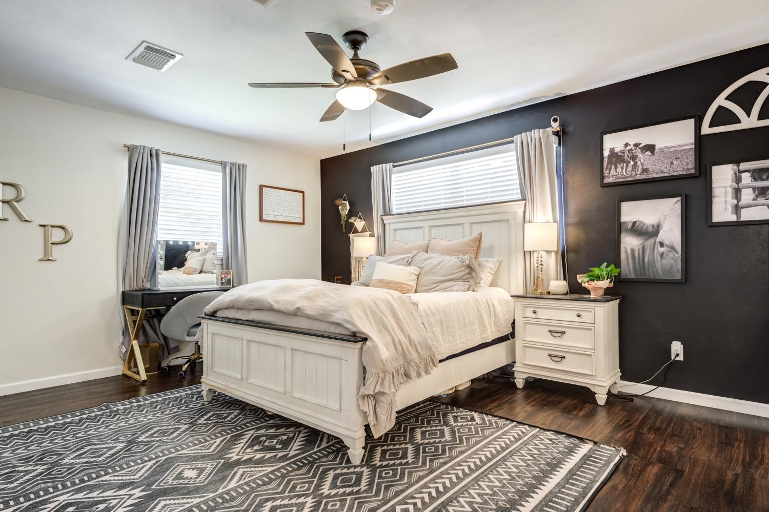 2306 61st Street Lubbock, TX 79412 - Photo 22 of 35 a bedroom with a large bed and a window