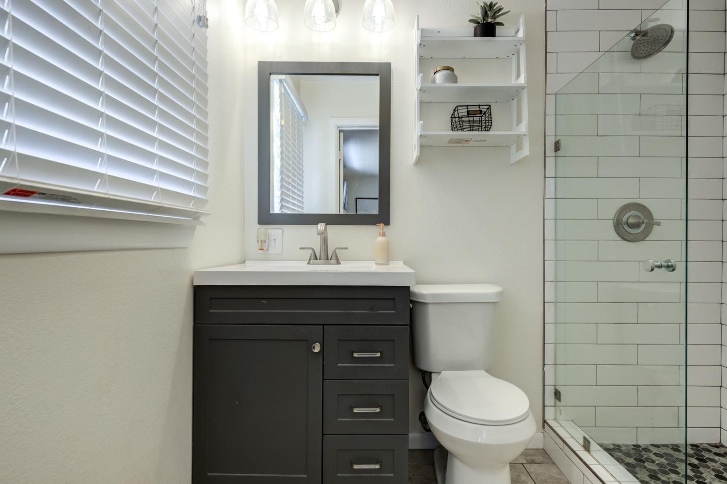 2306 61st Street Lubbock, TX 79412 - Photo 25 of 35 a bathroom with a sink toilet and shower