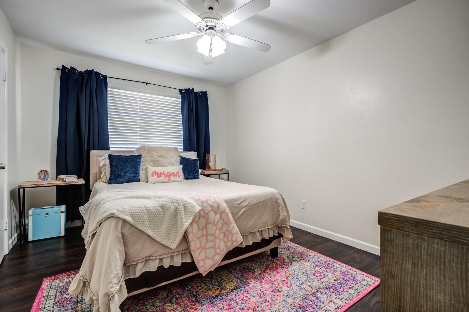 2306 61st Street Lubbock, TX 79412 - Photo 29 of 35 a bedroom with a bed and wooden floor