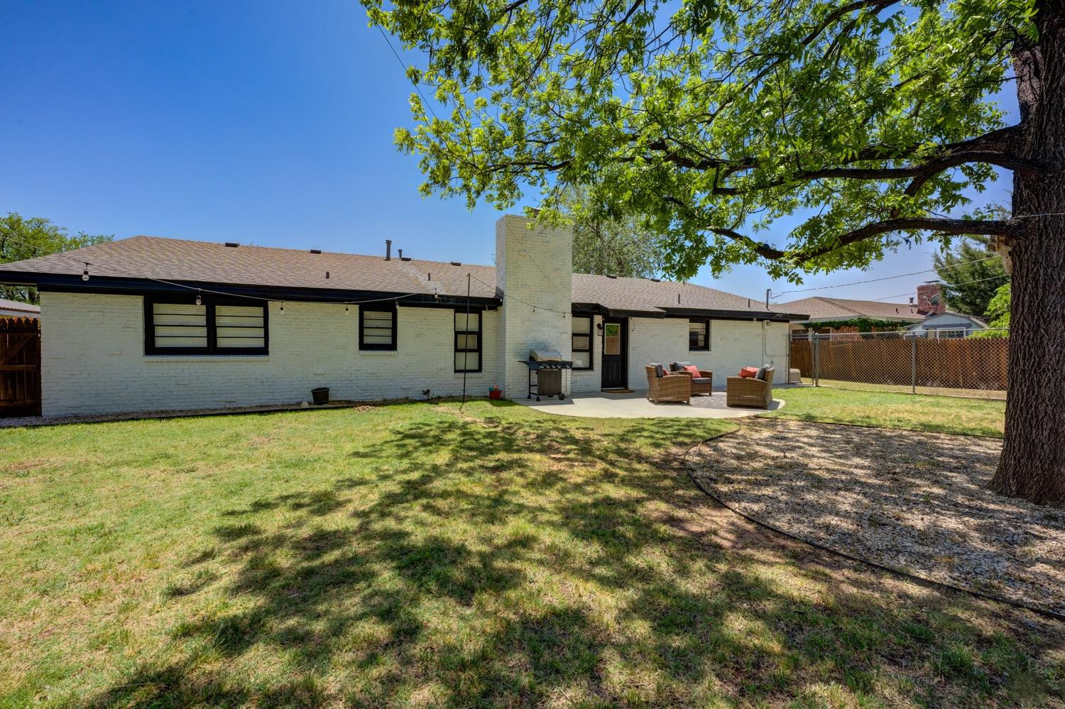 2306 61st Street Lubbock, TX 79412 - Photo 31 of 35 a front view of a house with a garden