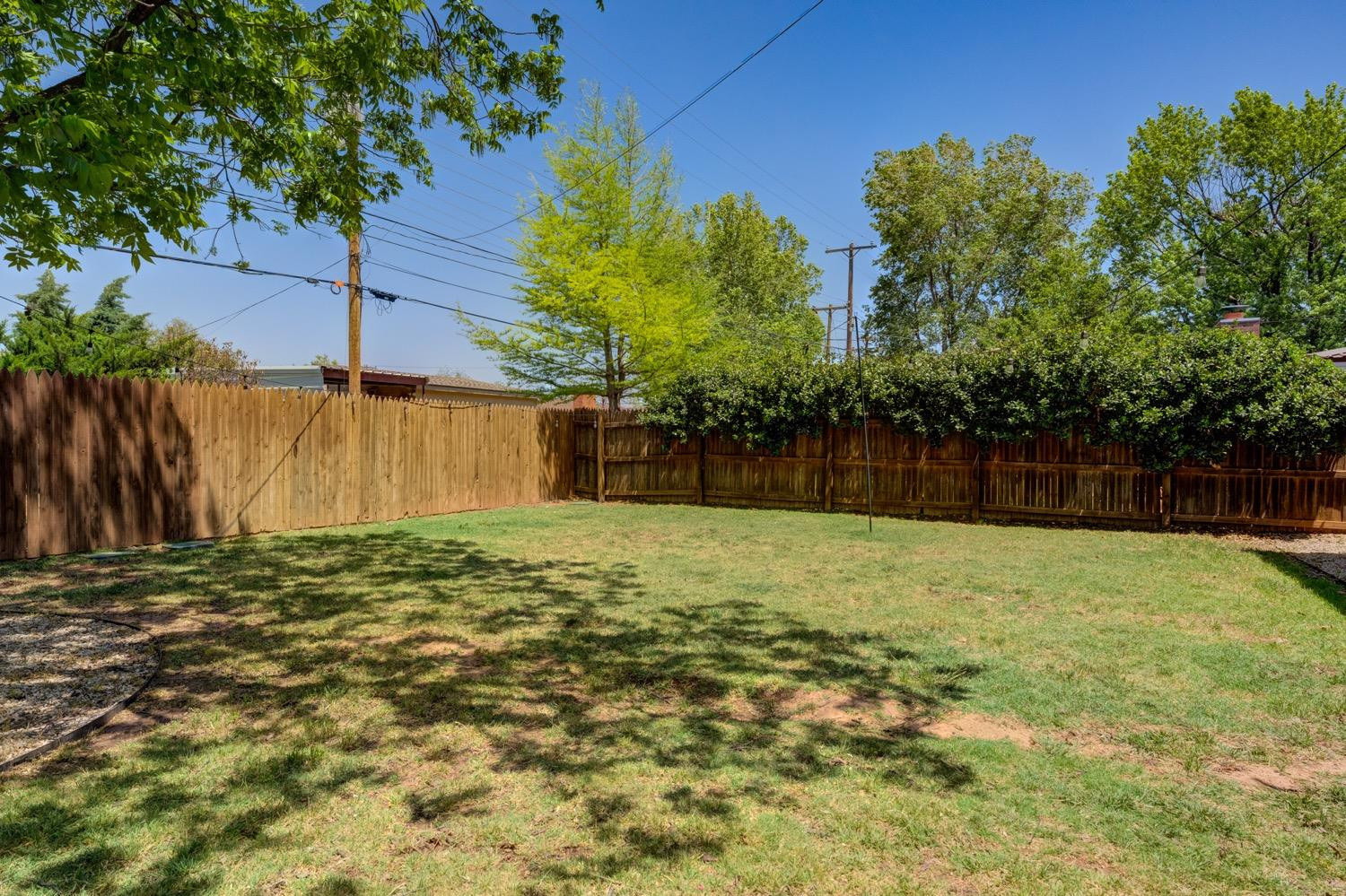 2306 61st Street Lubbock, TX 79412 - Photo 32 of 35 a backyard of a house with lots of green space