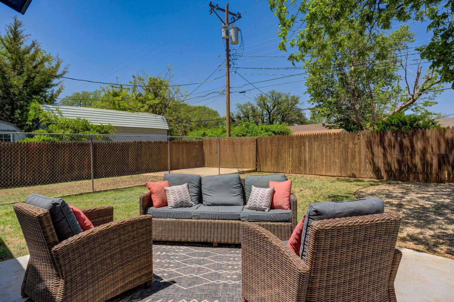 2306 61st Street Lubbock, TX 79412 - Photo 34 of 35 a outdoor living space with furniture and a garden