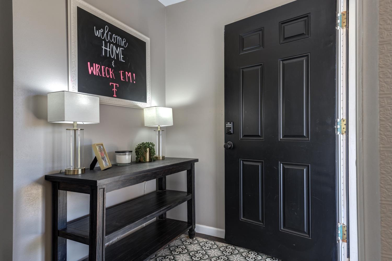 2306 61st Street Lubbock, TX 79412 - Photo 5 of 35 a room with a table and a lamp on table