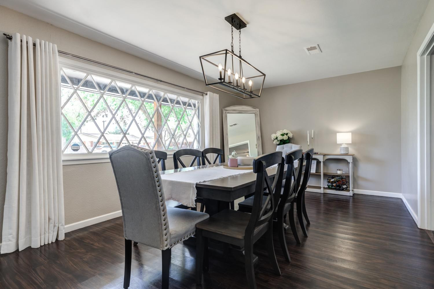 2306 61st Street Lubbock, TX 79412 - Photo 7 of 35 a view of a dining room with furniture window and wooden floor