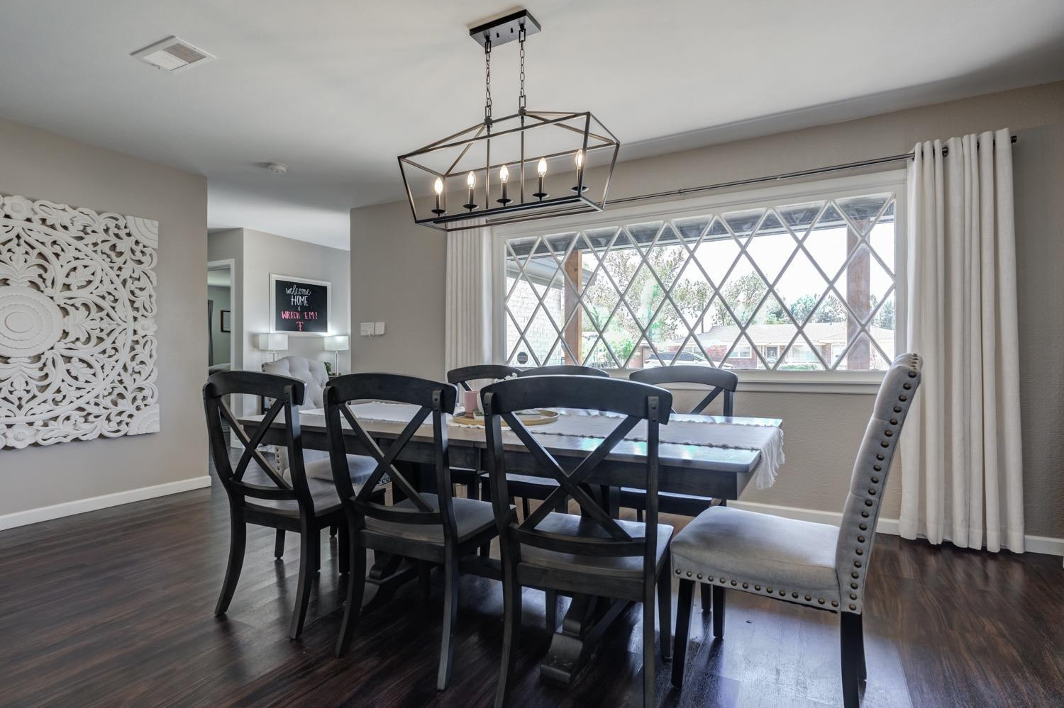 2306 61st Street Lubbock, TX 79412 - Photo 8 of 35 a view of a dining room with furniture window and wooden floor