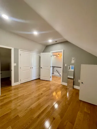 a kitchen with stainless steel appliances kitchen island granite countertop a stove a sink and a refrigerator