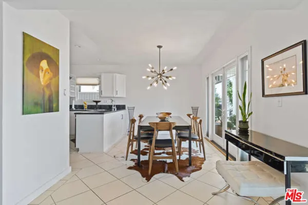 a dining room with furniture and chandelier
