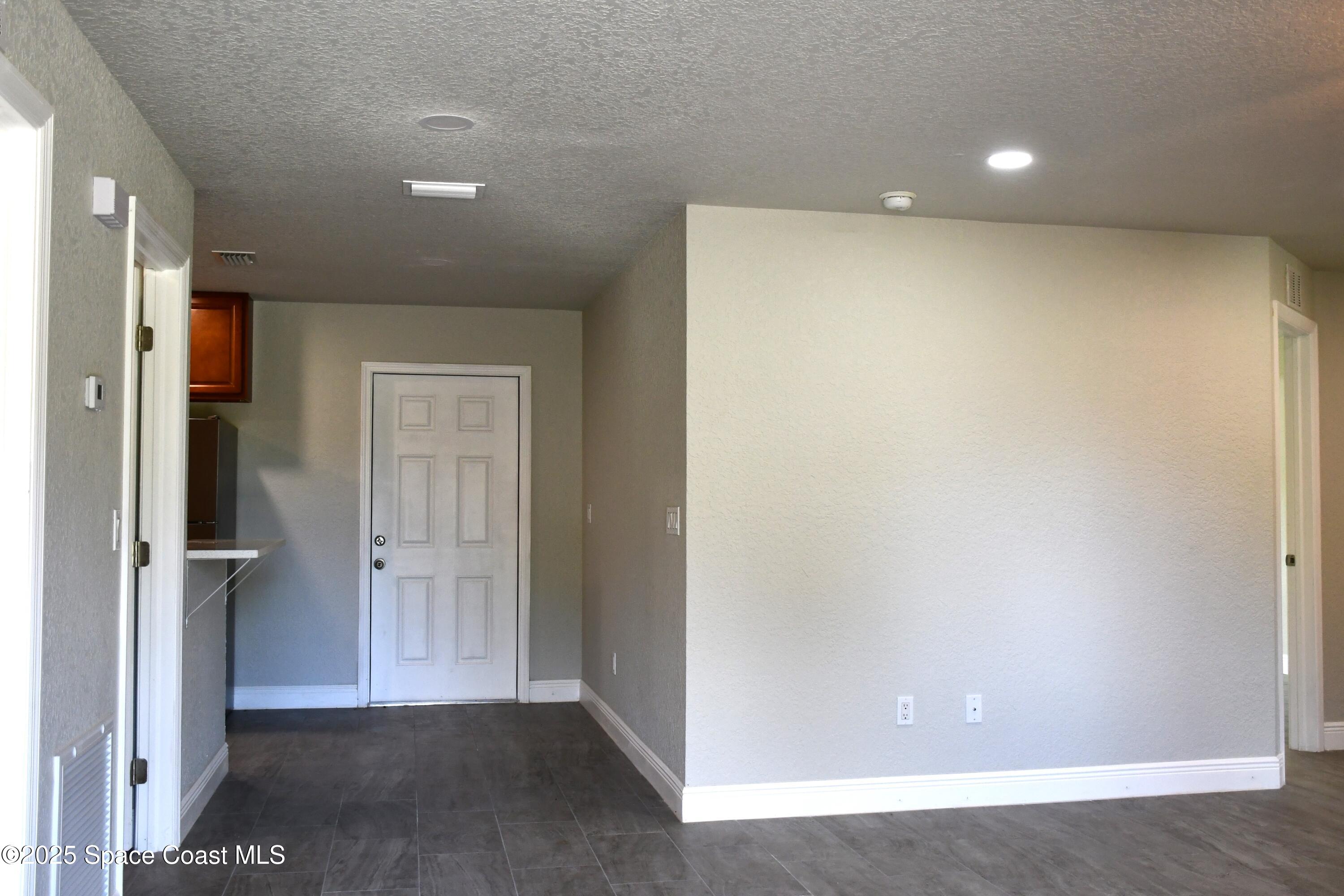 1515 Furnari Street Cocoa, FL 32922 - Photo 7 of 14 an empty room with closet