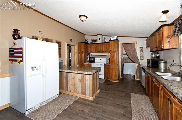 Kitchen.  Back closet is set up for laundry and has furnace 