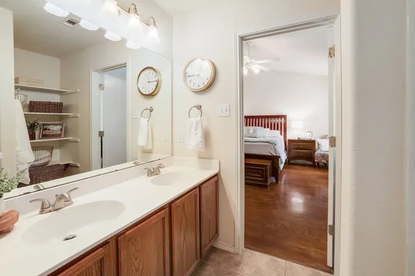 a en suite bathroom with a sink and a mirror