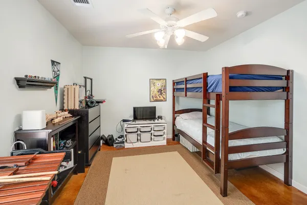 a bedroom with furniture and a chandelier