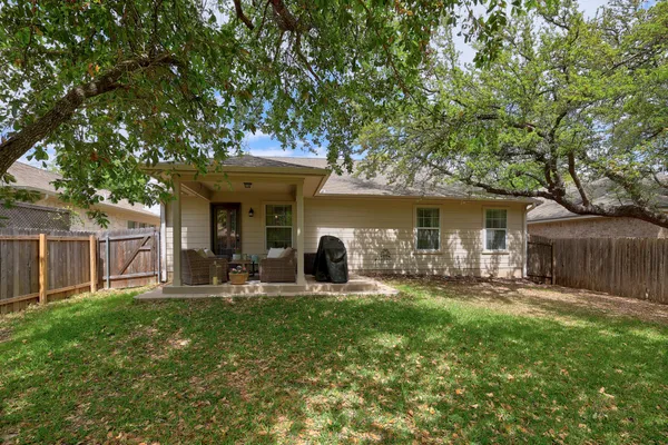 a front view of house with yard and outdoor seating