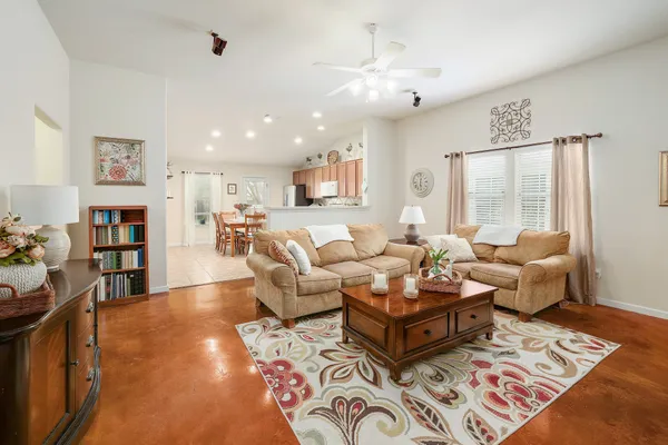 a living room with furniture fireplace and a window