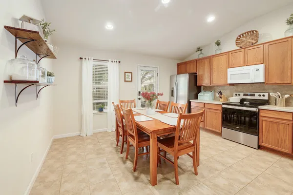 a view of a dining room kitchen and a window