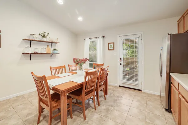 a dining room with furniture and window