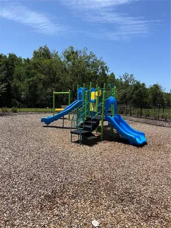 a view of a entertaining space with wooden fence