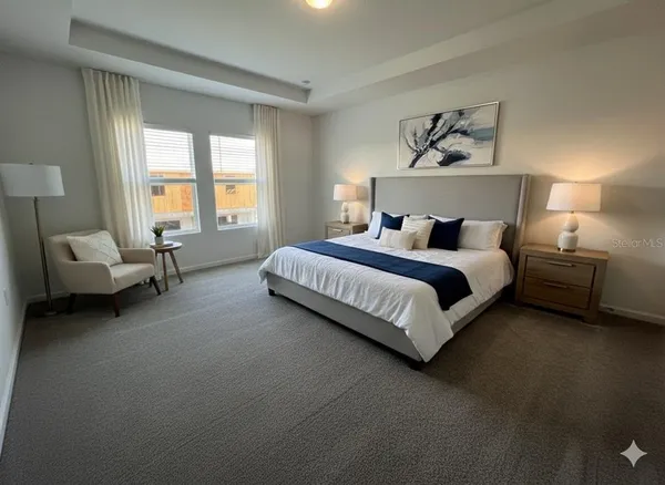 a spacious bedroom with a bed and a couch