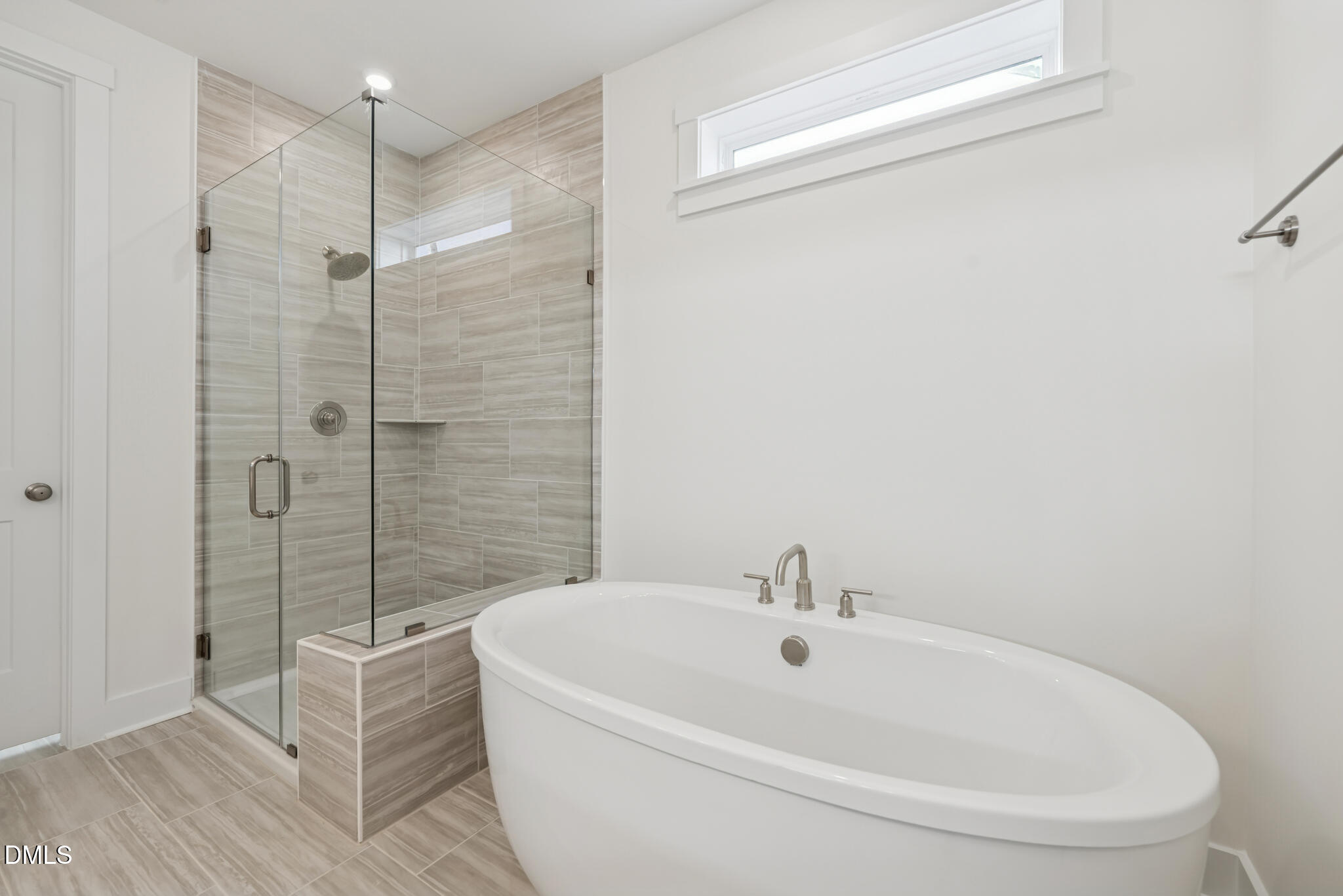 1213 Opal Lane Durham, NC 27705 - Photo 10 of 50 a white bath tub sitting next to a white sink and a shower