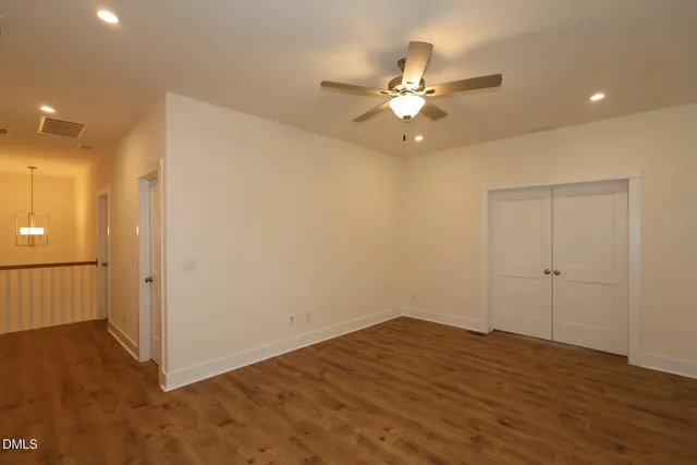 a kitchen with kitchen island a large counter top appliances and cabinets