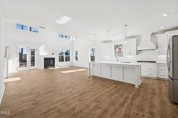 a view of an entryway with floor to ceiling window and fireplace