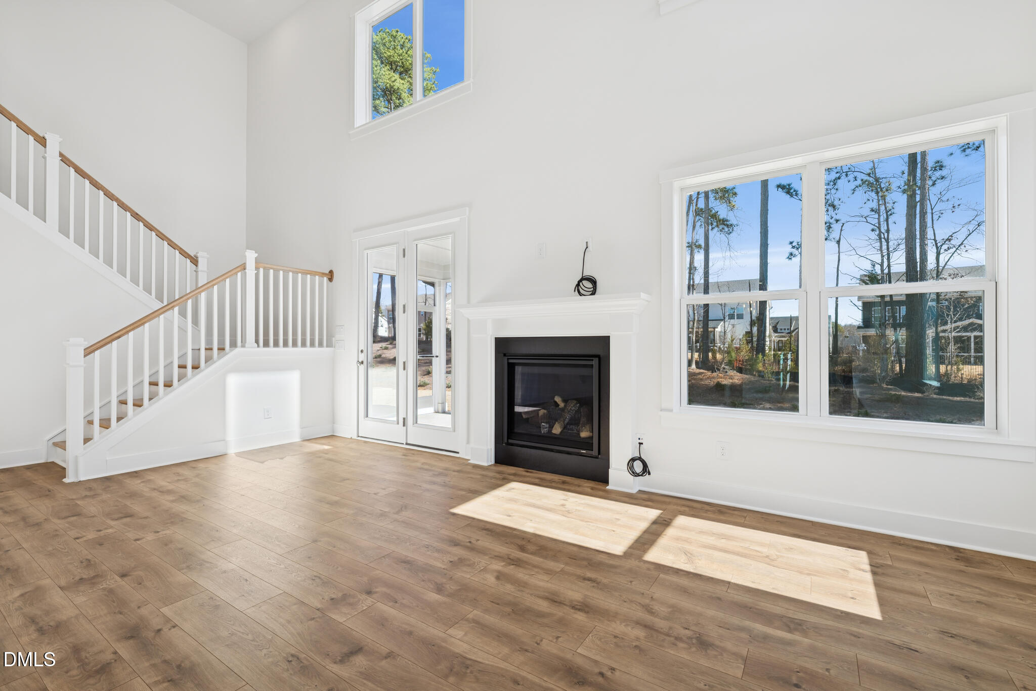 1213 Opal Lane Durham, NC 27705 - Photo 17 of 50 a view of an empty room with wooden floor and a window