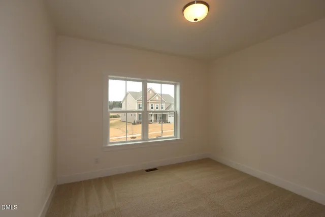 a bathroom with a glass shower door and a sink