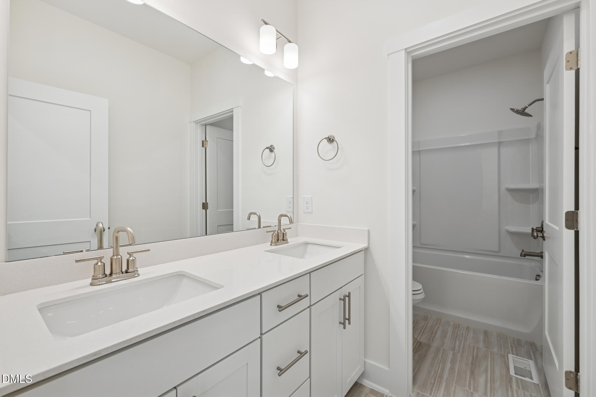 1213 Opal Lane Durham, NC 27705 - Photo 24 of 50 a bathroom with a sink vanity granite tub shower and a mirror