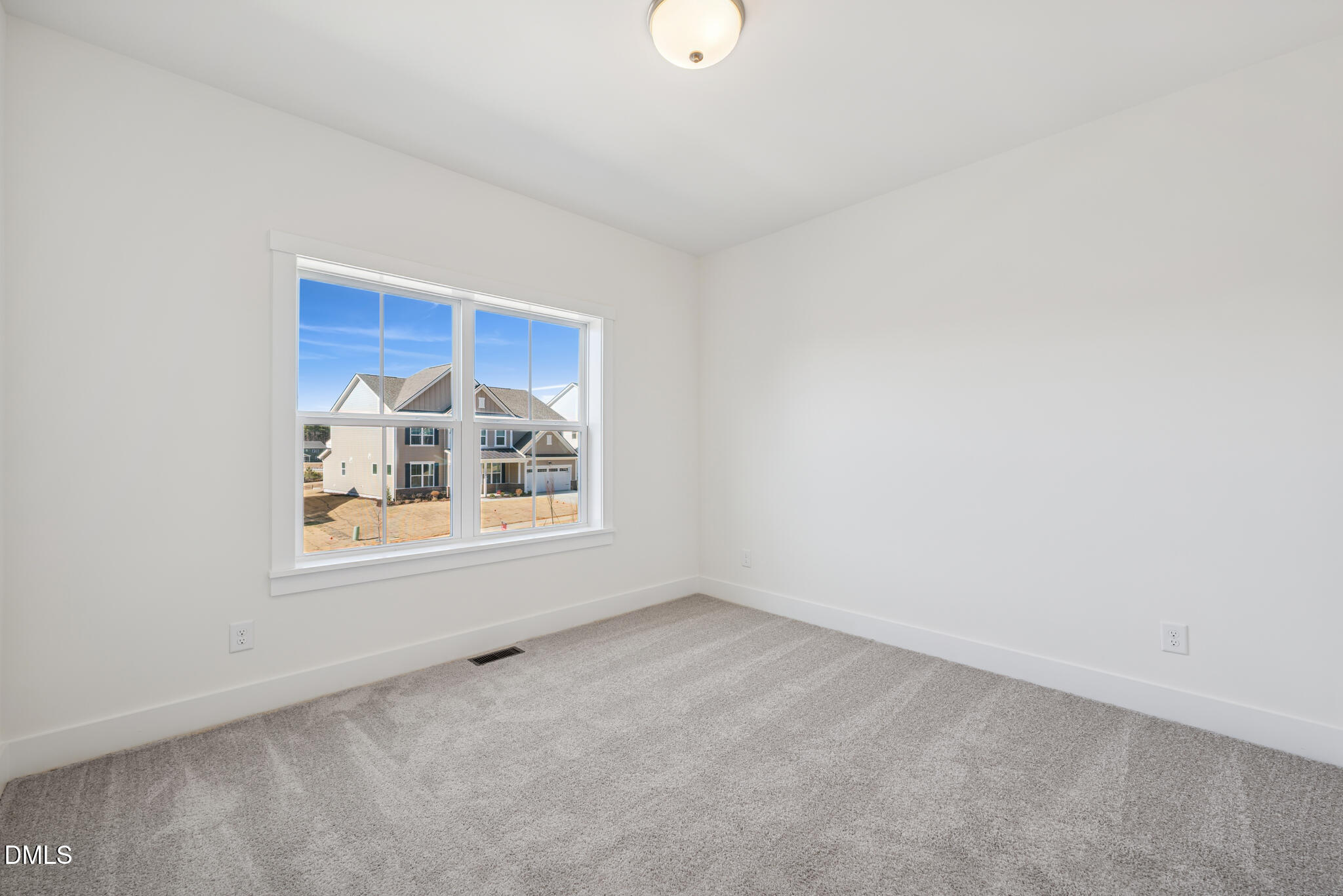 1213 Opal Lane Durham, NC 27705 - Photo 25 of 50 a view of an empty room with a window