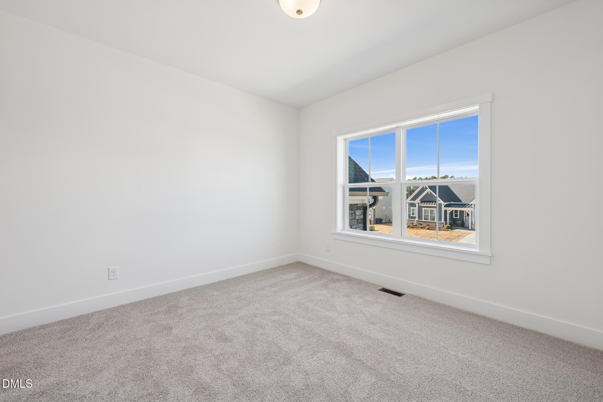 1213 Opal Lane Durham, NC 27705 - Photo 26 of 50 a view of an empty room with a window