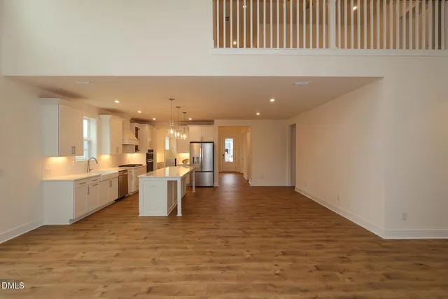 a view of a kitchen and kitchen with furniture