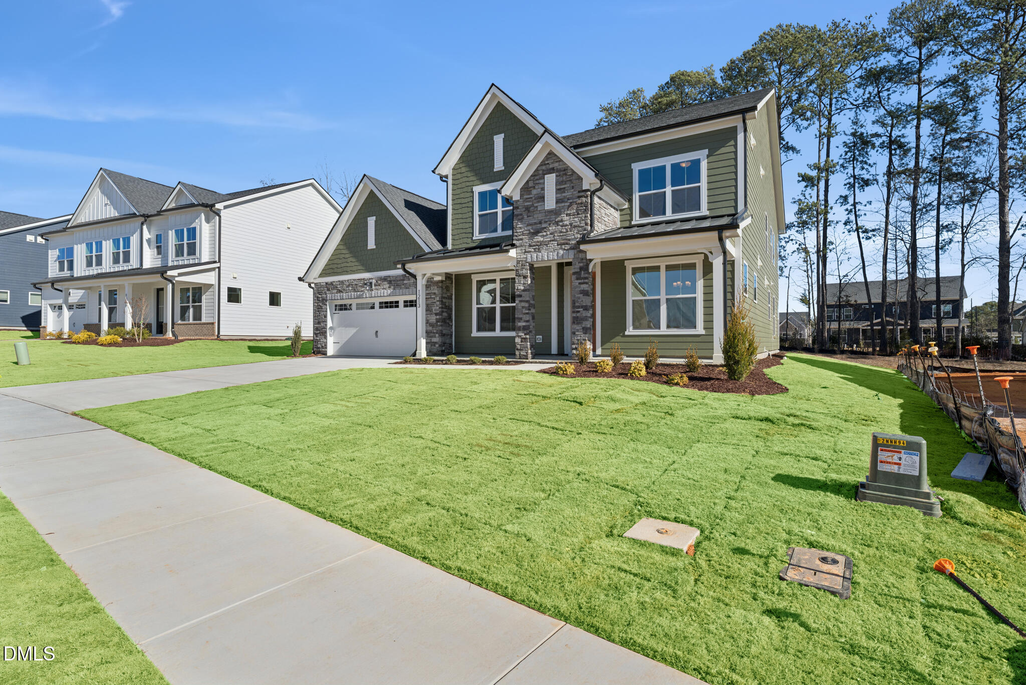 1213 Opal Lane Durham, NC 27705 - Photo 2 of 50 a front view of a house with a yard and garage