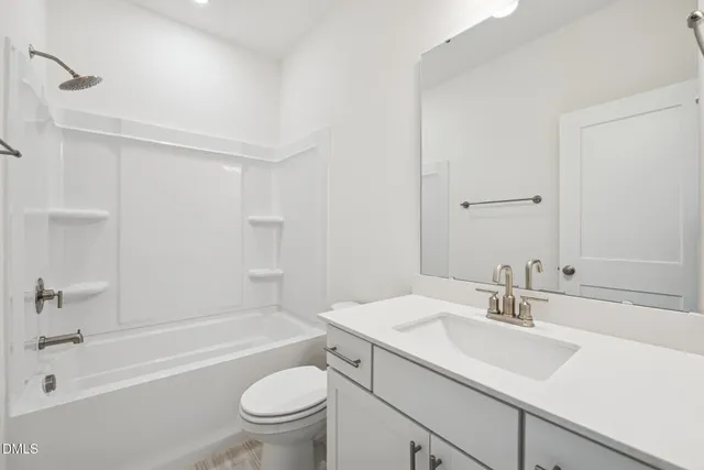 a bathroom with a sink a toilet and a bathtub