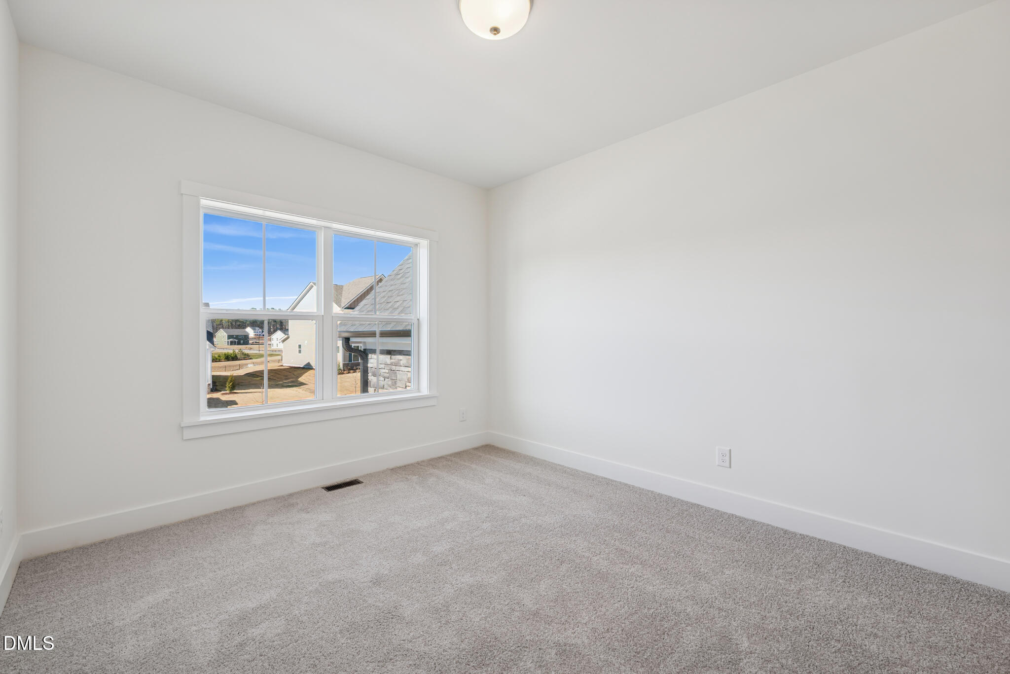 1213 Opal Lane Durham, NC 27705 - Photo 31 of 50 a view of an empty room with a window