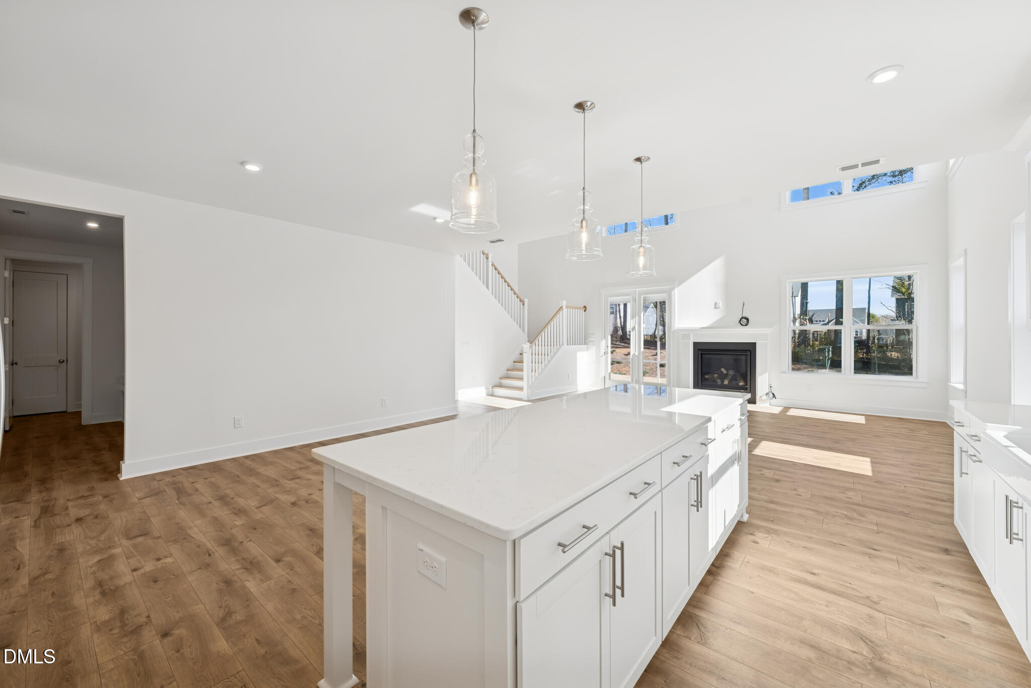 1213 Opal Lane Durham, NC 27705 - Photo 40 of 50 a large white kitchen with a large stove a sink and kitchen island