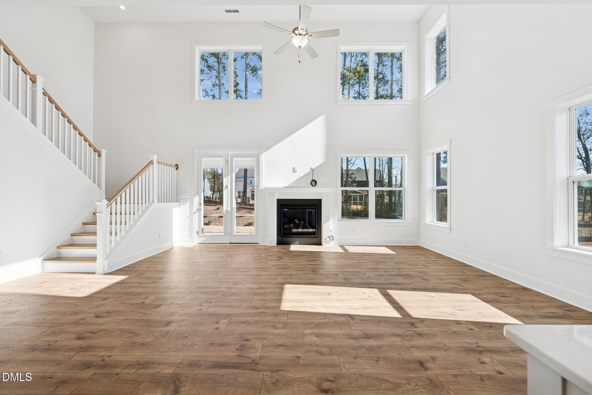 1213 Opal Lane Durham, NC 27705 - Photo 41 of 50 a view of an entryway with floor to ceiling window and fireplace