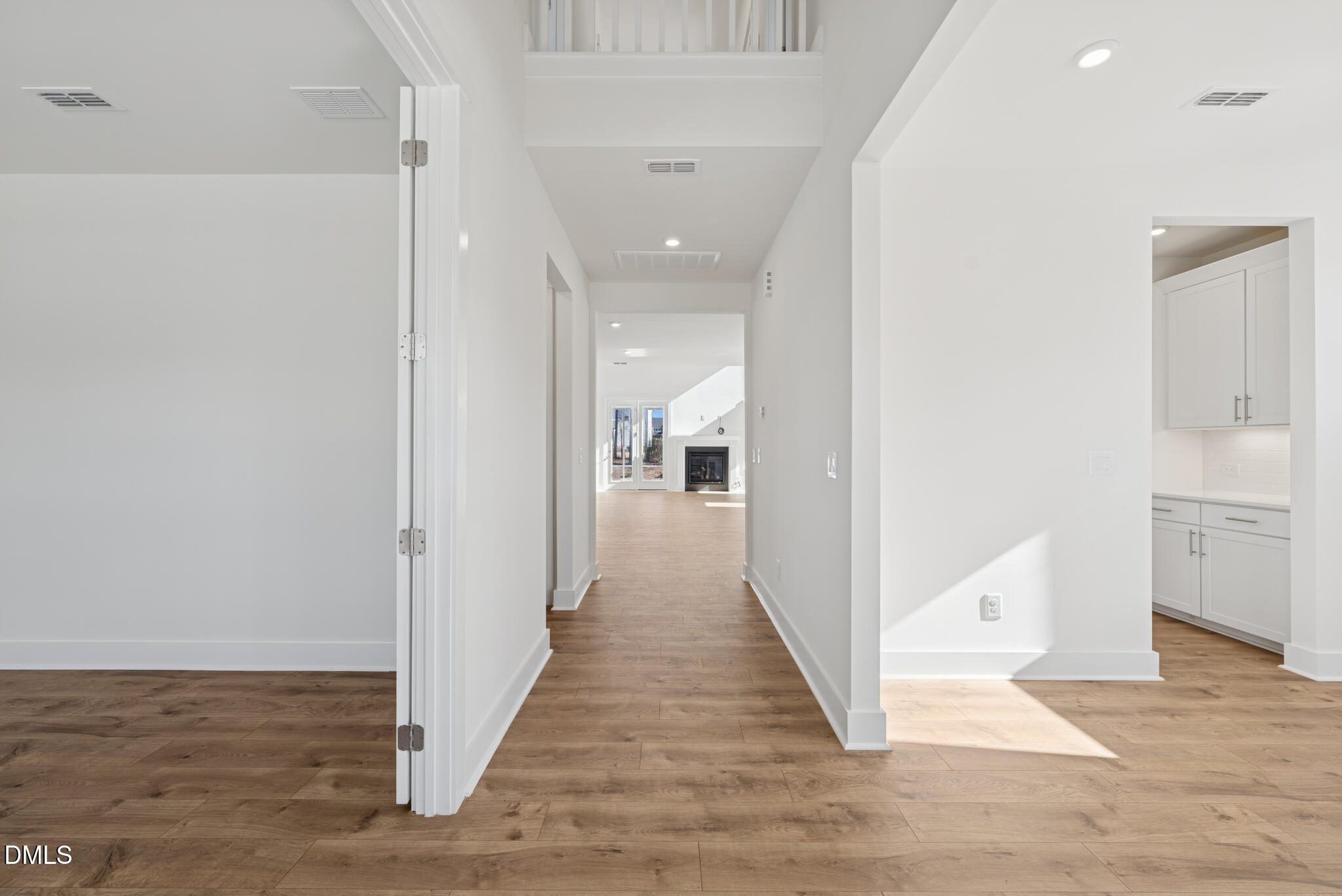 1213 Opal Lane Durham, NC 27705 - Photo 44 of 50 a view of a hallway with wooden floor