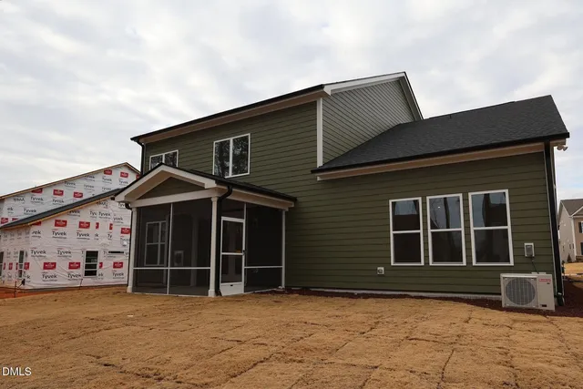 front view of a house with a large window