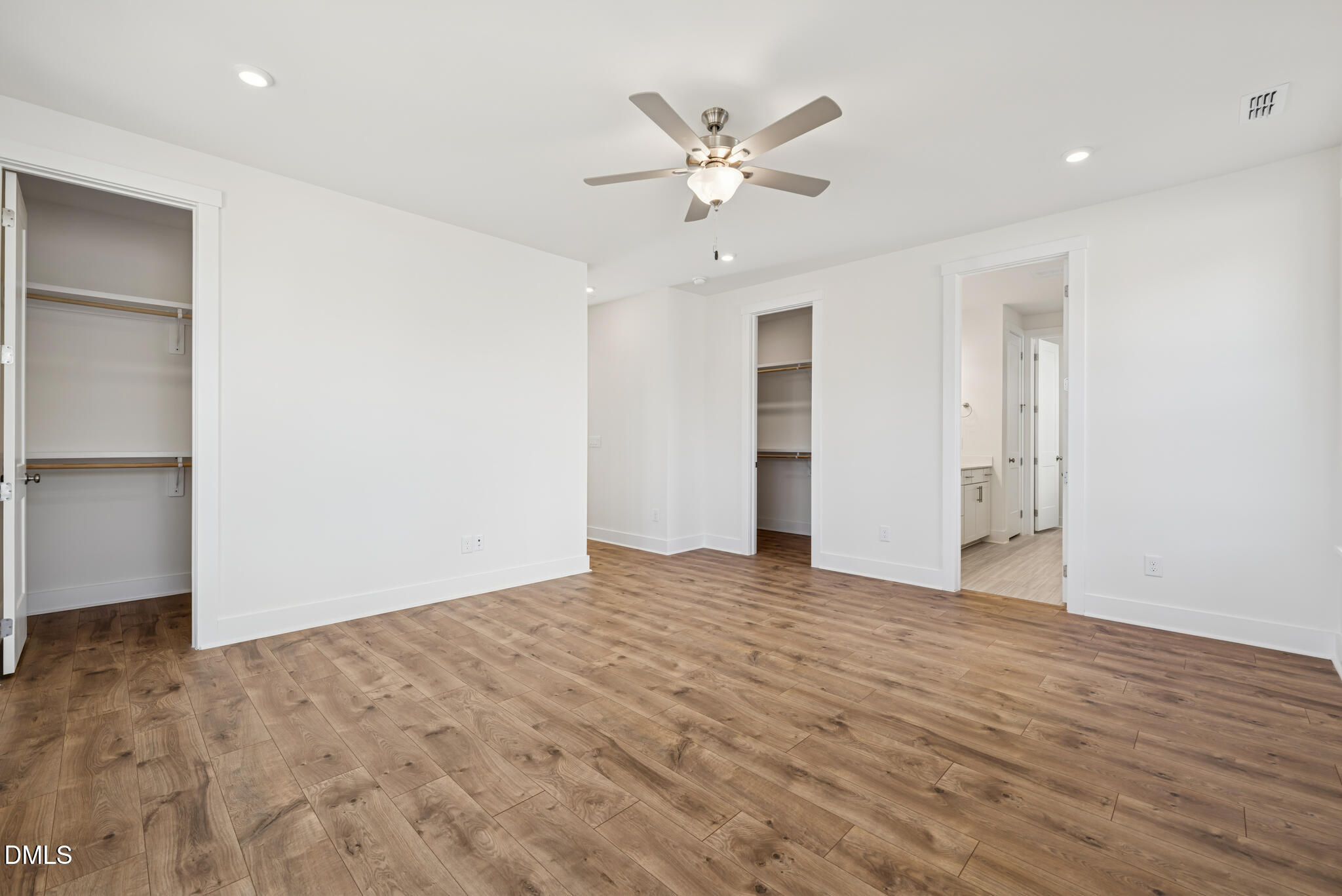 1213 Opal Lane Durham, NC 27705 - Photo 7 of 50 an empty room with wooden floor and ceiling fan
