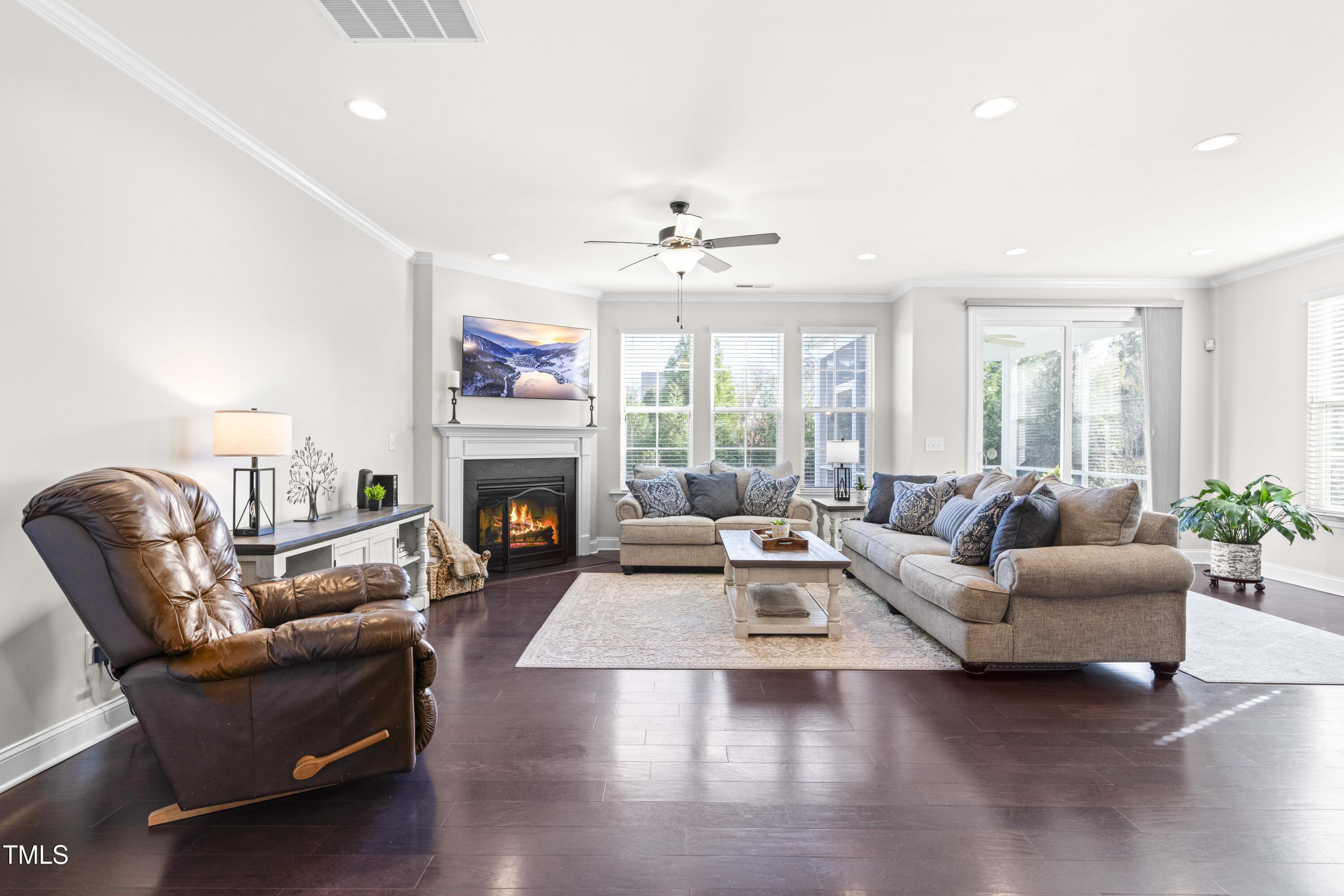 1805 Bodwin Lane Apex, NC 27502 - Photo 12 of 43 a living room with furniture and a fireplace