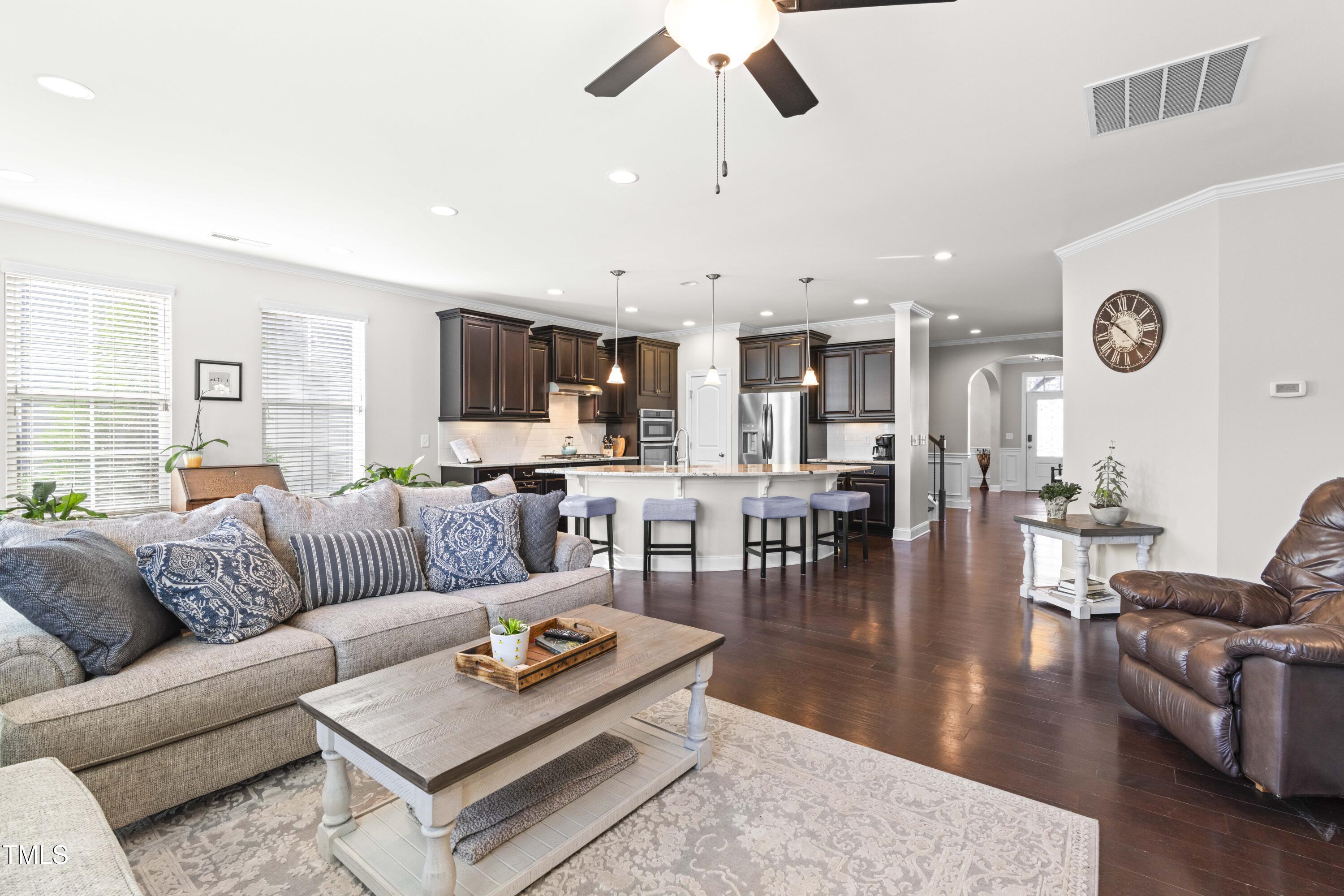 1805 Bodwin Lane Apex, NC 27502 - Photo 14 of 43 a living room with furniture kitchen view and a large window