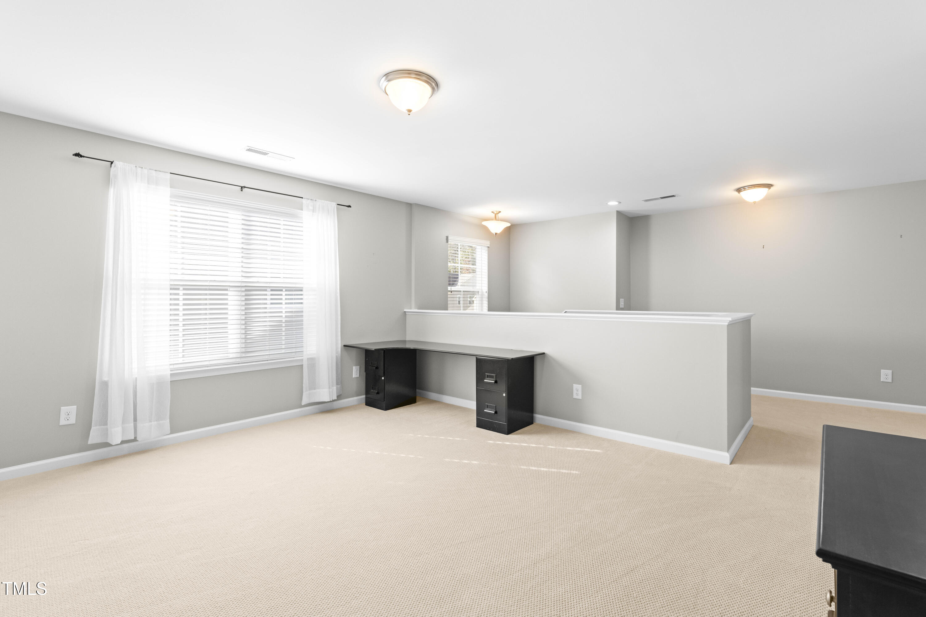 1805 Bodwin Lane Apex, NC 27502 - Photo 20 of 43 a view of an empty room with a window