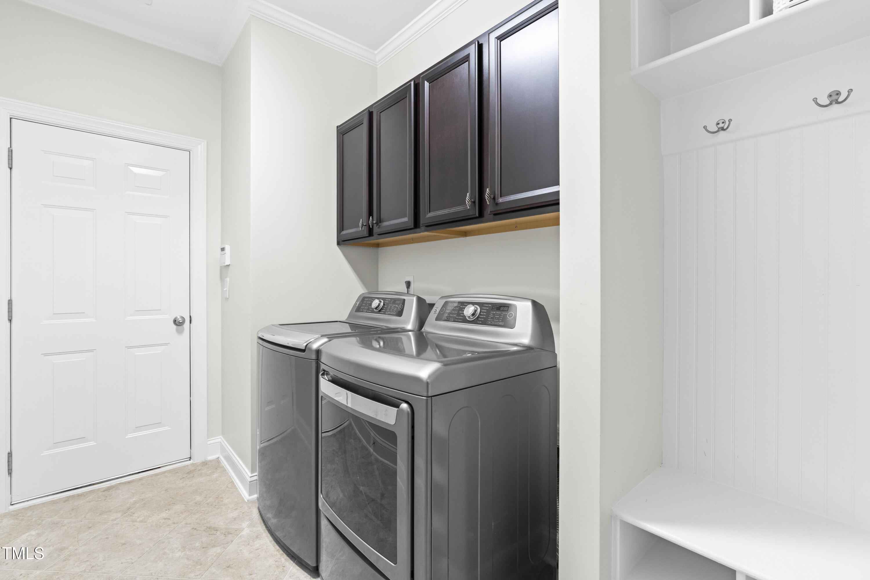 1805 Bodwin Lane Apex, NC 27502 - Photo 26 of 43 a utility room with stainless steel appliances granite countertop a sink and a mirror
