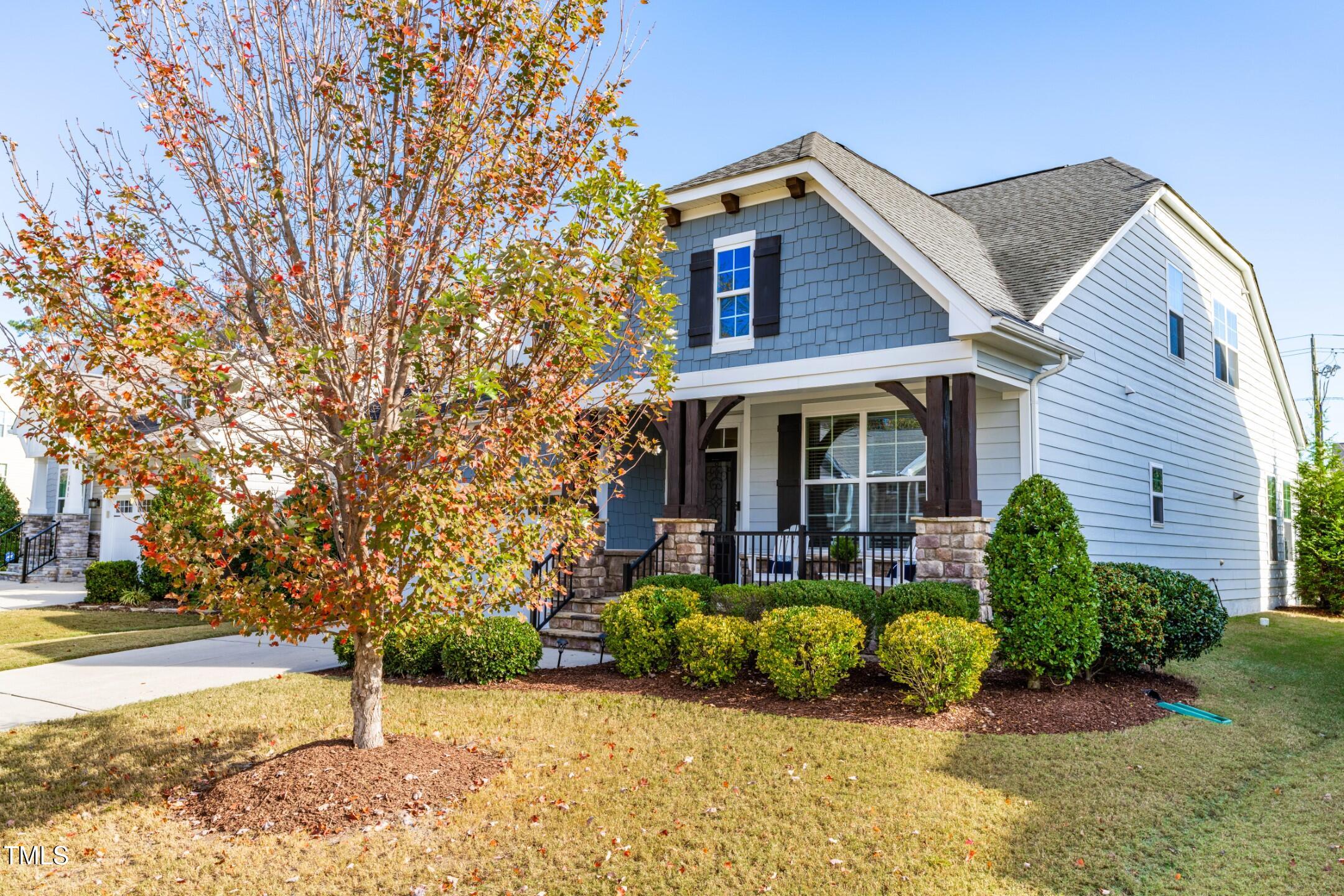 1805 Bodwin Lane Apex, NC 27502 - Photo 35 of 43 a view of a house with a large tree and a yard